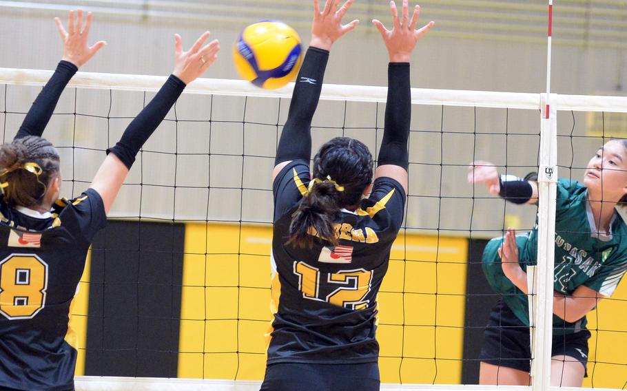 Yuri Biggins spikes the ball.