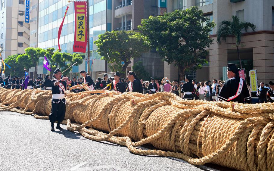 Locals, toursits and U.S. service members wait to witness or participate in the Tug-of-War Festival in Naha, Okinawa, Oct. 12, 2025. This year’s rope measured about 524 feet long, four feet in diameter and weighed 36 tons.