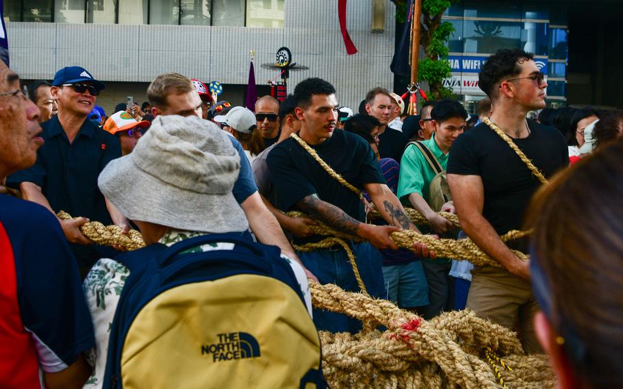 U.S. service members participate in the annual Tug-of-War Festival in Naha, Okinawa, Oct. 12, 2025.