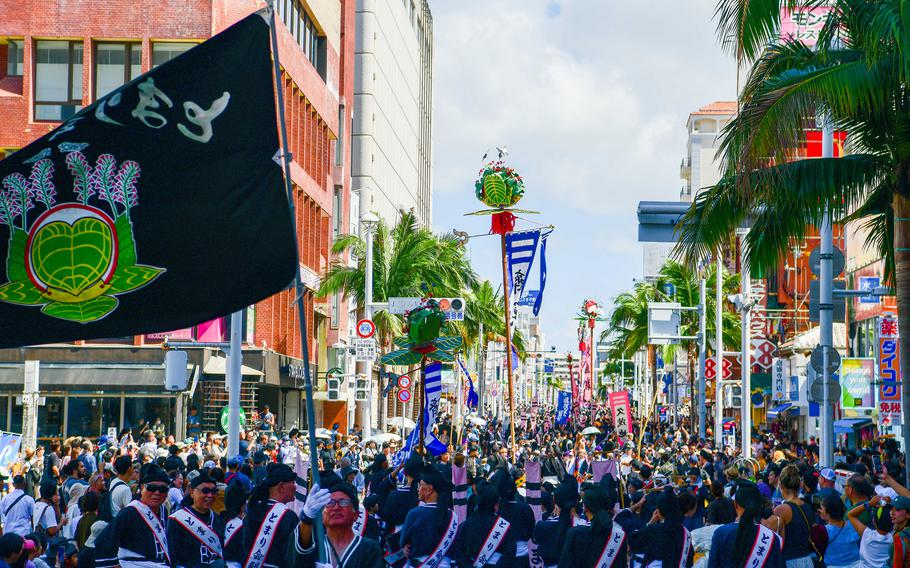 Locals, toursits and U.S. service members wait to witness or participate in the Tug-of-War Festival in Naha, Okinawa, Oct. 12, 2025.