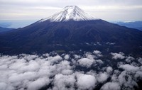 The summit of Mount Fuji with its first snowcap of the season is seen on Oct. 23, 2025, in this photo taken from a Mainichi Shimbun helicopter. (Mainichi)