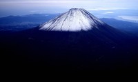 The summit of Mount Fuji with its first snowcap of the season is seen on Oct. 23, 2025, in this photo taken from a Mainichi Shimbun helicopter. (Mainichi)