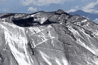 The summit of Mount Fuji with its first snowcap of the season is seen on Oct. 23, 2025, in this photo taken from a Mainichi Shimbun helicopter. (Mainichi)