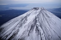 The summit of Mount Fuji with its first snowcap of the season is seen on Oct. 23, 2025, in this photo taken from a Mainichi Shimbun helicopter. (Mainichi)