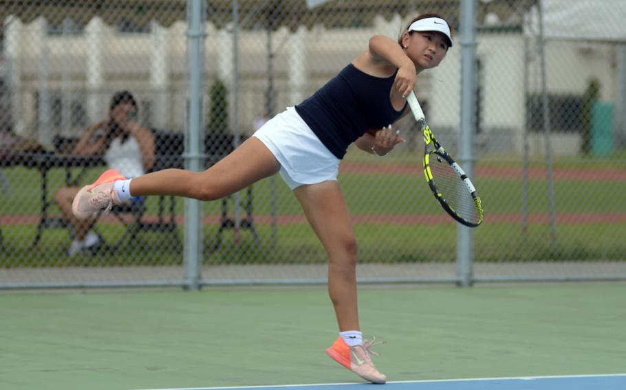 Chloe Lee follows through on a serve.