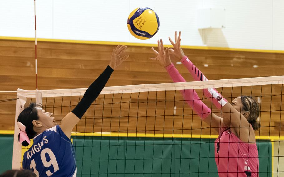 Sakurako Abe and Mila Nishimura-Reed battle at the net.
