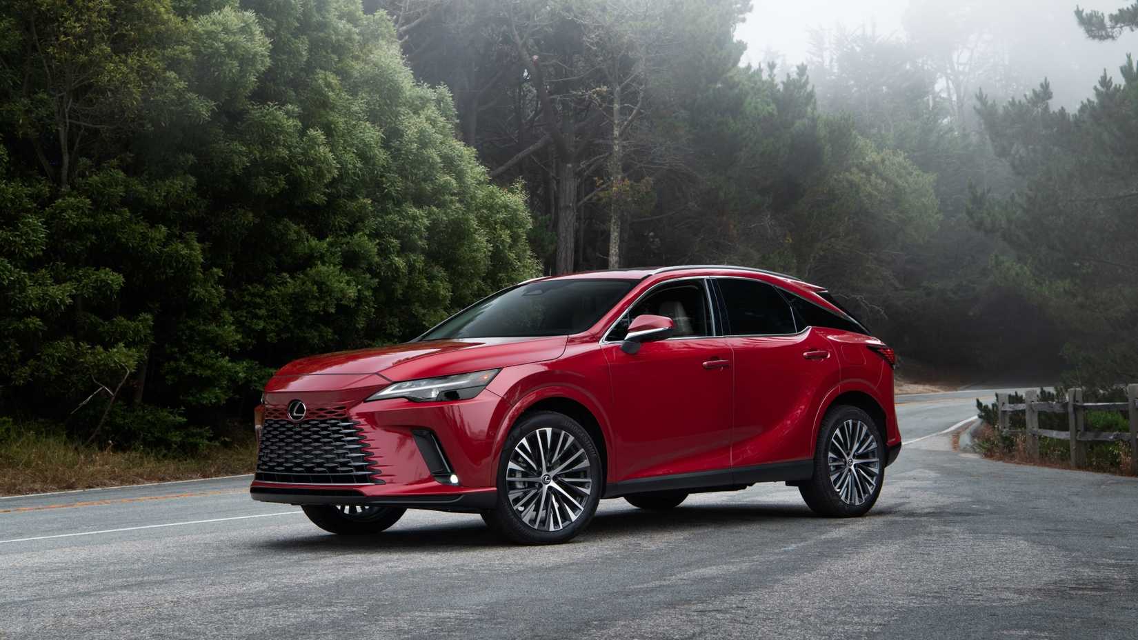 Static front 3/4 shot of a red 2025 Lexus RX 350h.