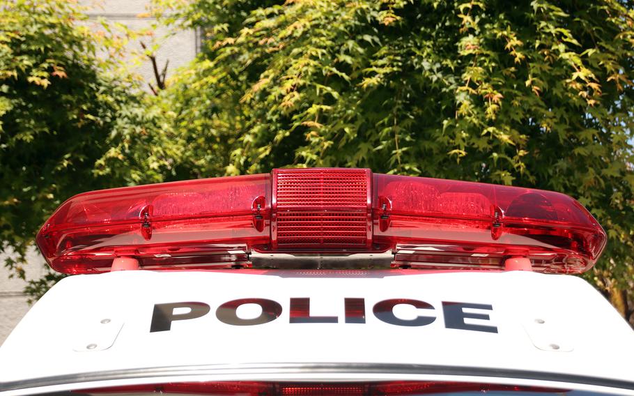 Red lights sit atop a police car.