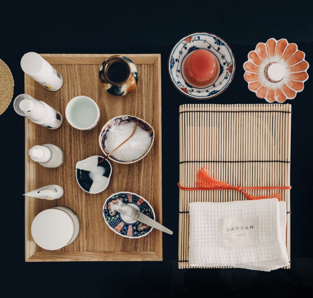 An overhead view of DAMDAM products on bamboo trays.
