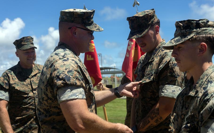 Marines in a ceremony receiving medals.