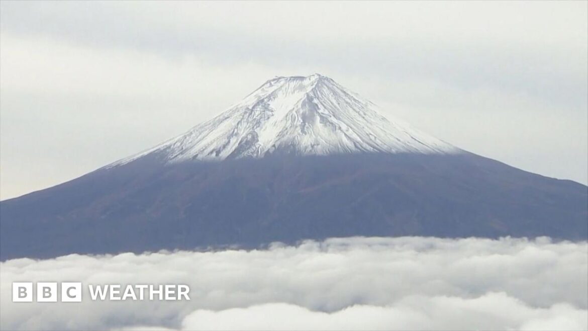 First snowfall of season on Japan’s Mount Fuji Thin, blue banner promoting the Cooler Than Me? weather game with text saying: "Play: Cooler Than Me? The new guessing game from BBC Weather"