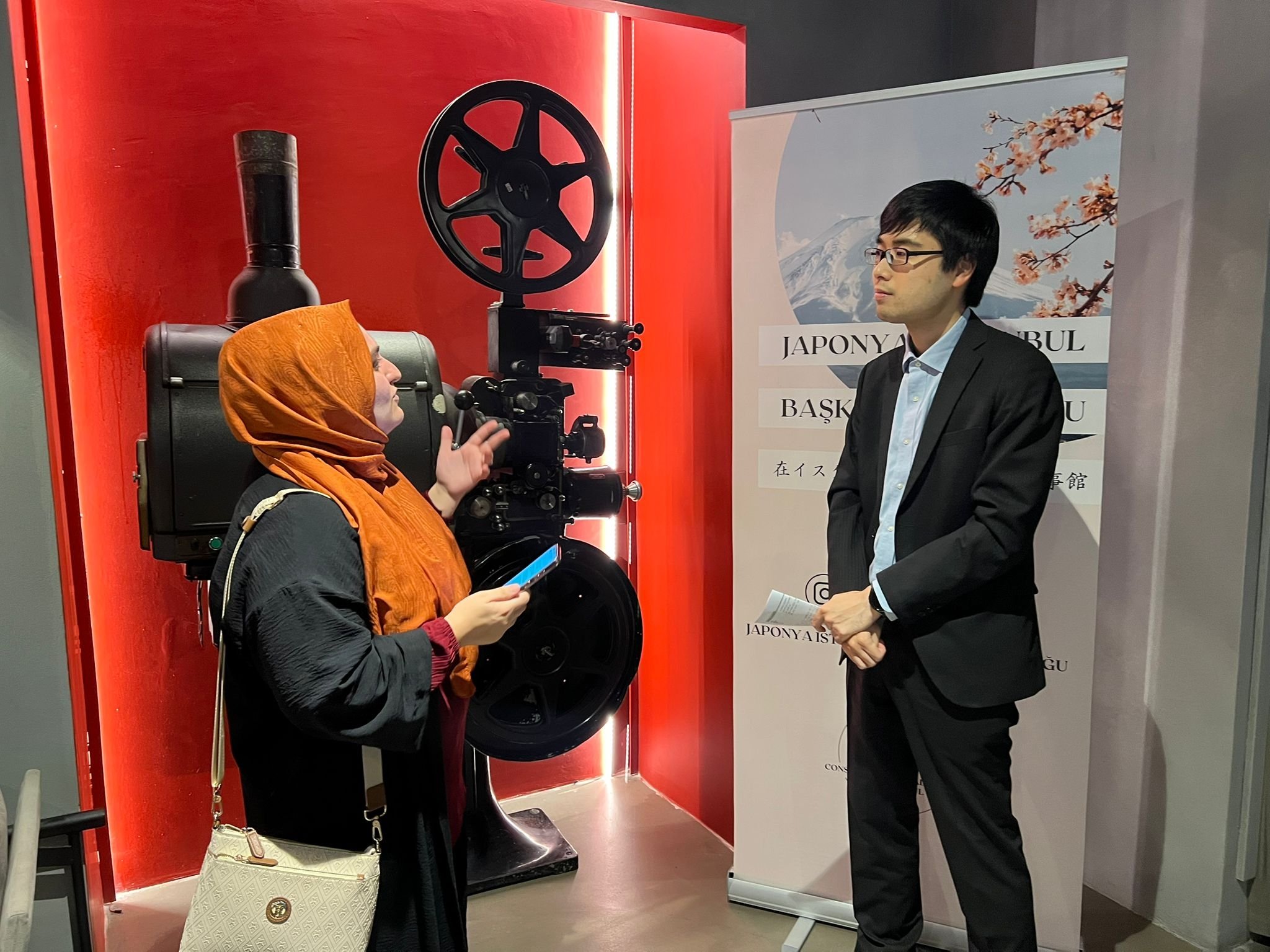 Nozomu Fujimori, Japan’s cultural attache, speaks with Daily Sabah editor Ayşe Sena Aykın during an interview at the Japanese Film Festival, Istanbul, Türkiye, Oct. 23, 2025. (Photo by Ayşe Sena Aykın)