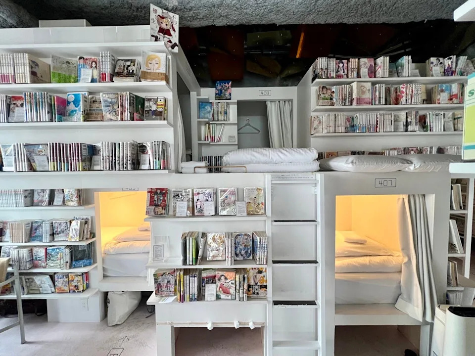 Hostel with bookshelves, capsule-style bunks