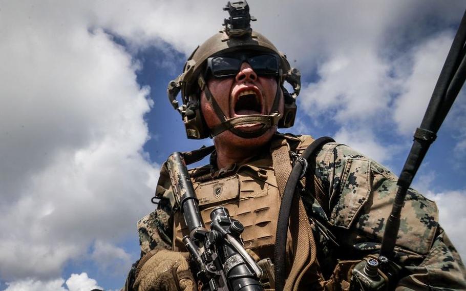 U.S. Marine Corps Cpl. Jose FigueroaRubio, a rifleman with 1st Light Armored Reconnaissance Company, Battalion Landing Team 1st Battalion, 7th Marine Regiment, 31st Marine Expeditionary Unit, calls for an all-out assault.
