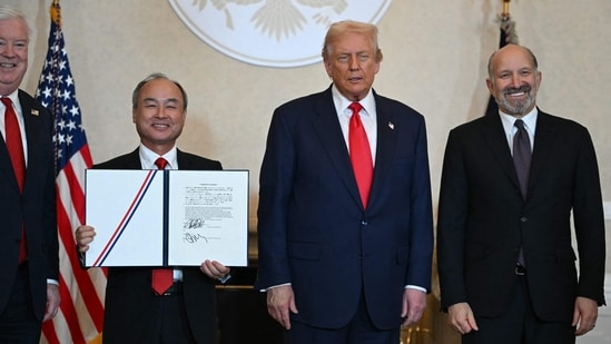 Trump (2nd R), US Secretary of Commerce Howard Lutnick (R) and US Ambassador to Japan George Glass (L) pose with Masayoshi Son, CEO of SoftBank, during a business leaders event at the US ambassador's residence in Tokyo on October 28, 2025. (Photo by ANDREW CABALLERO-REYNOLDS / AFP)(AFP)