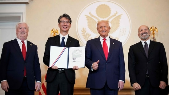 U.S. Ambassador to Japan George Glass, Toshiba CEO Taro Shimada, U.S. President Donald Trump and Secretary of Commerce Howard Lutnick pose for photos after the signing of memorandums of understanding during a meeting with business leaders at the U.S. Ambassador's Residence on October 28, 2025 in Tokyo, Japan. (Getty Images via AFP)