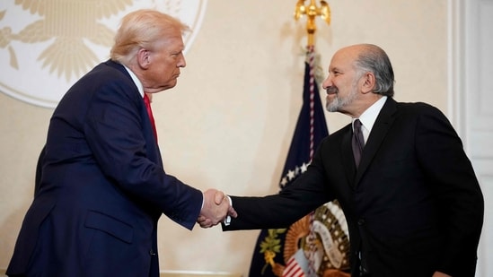Trump shakes hands with Secretary of Commerce Howard Lutnick during a meeting with Japanese business leaders at the U.S. Ambassador's Residence on October 28, 2025 in Tokyo, Japan. (Getty Images via AFP)