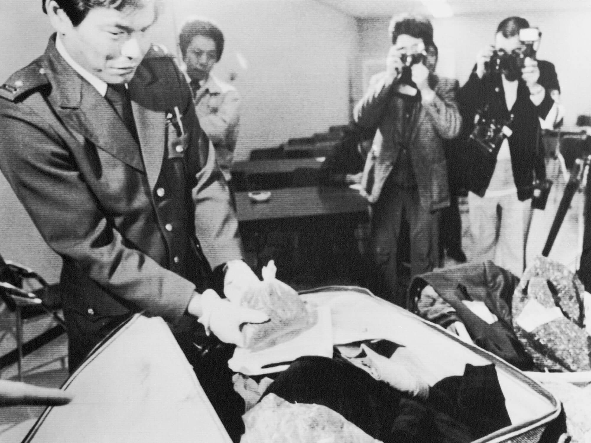 A customs officer inspects one of the plastic one of the plastic bags containing marijuana which hidden inside one of Paul McCartney's luggages after he was arrested for illegal possession of marijuana at New Tokyo International Airport in Narita 1/16.