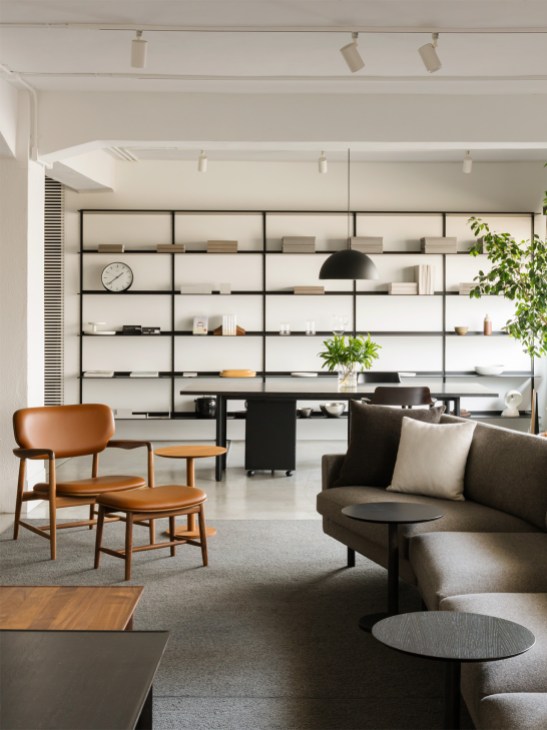Maruni showroom featuring the Meguro chair and footstool by Naoto Fukasawa