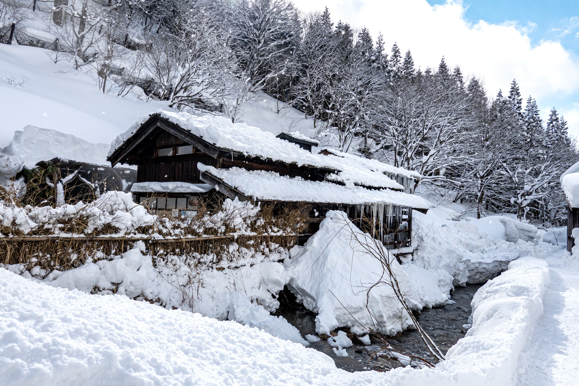exterior of Tsurunoyu Onsen in Semboku City / Akita Region of Japan on a snowy winter's day