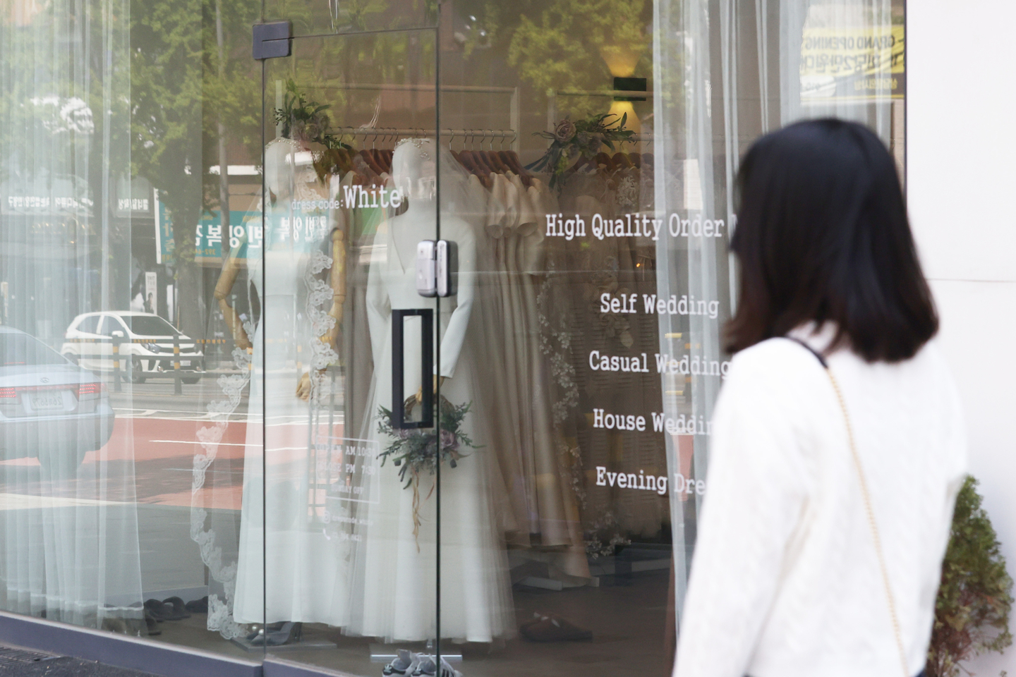 Wedding dresses on display at a bridal shop on Wedding Street in Ahyeon-dong, Mapo District, Seoul. [YONHAP] 