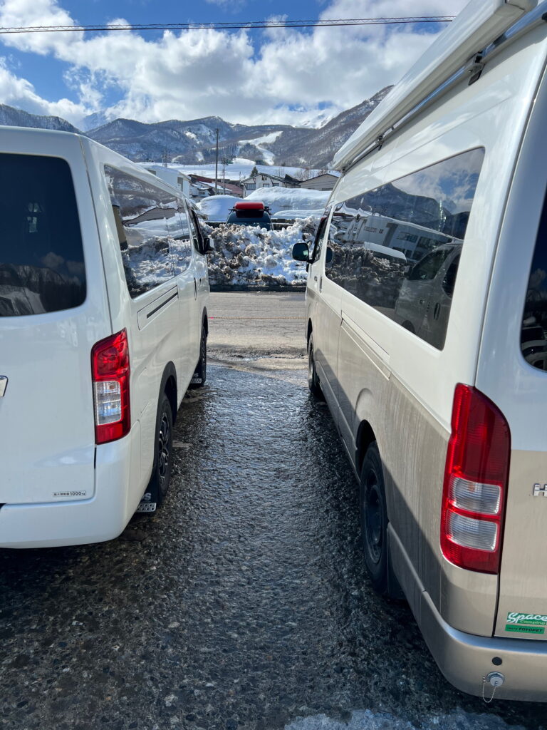 The Grand Cabin Toyota Hiace next to the smaller standard Hiace camper.