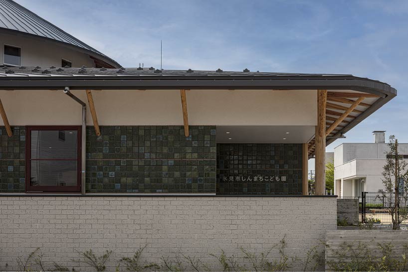 curved wooden frame shapes light-filled daycare center in japan encouraging playful learning