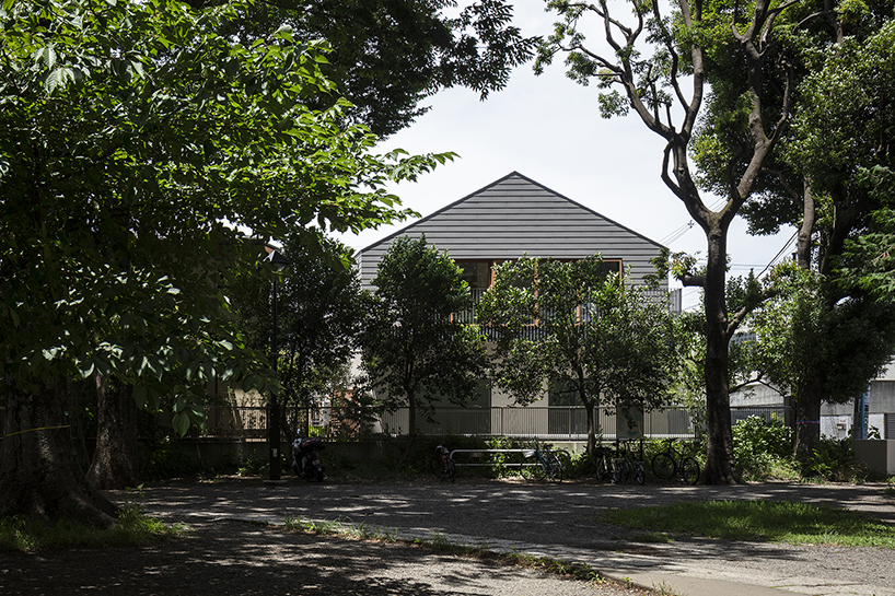 circular aperture welcomes natural light within gabled tokyo house by KIAS