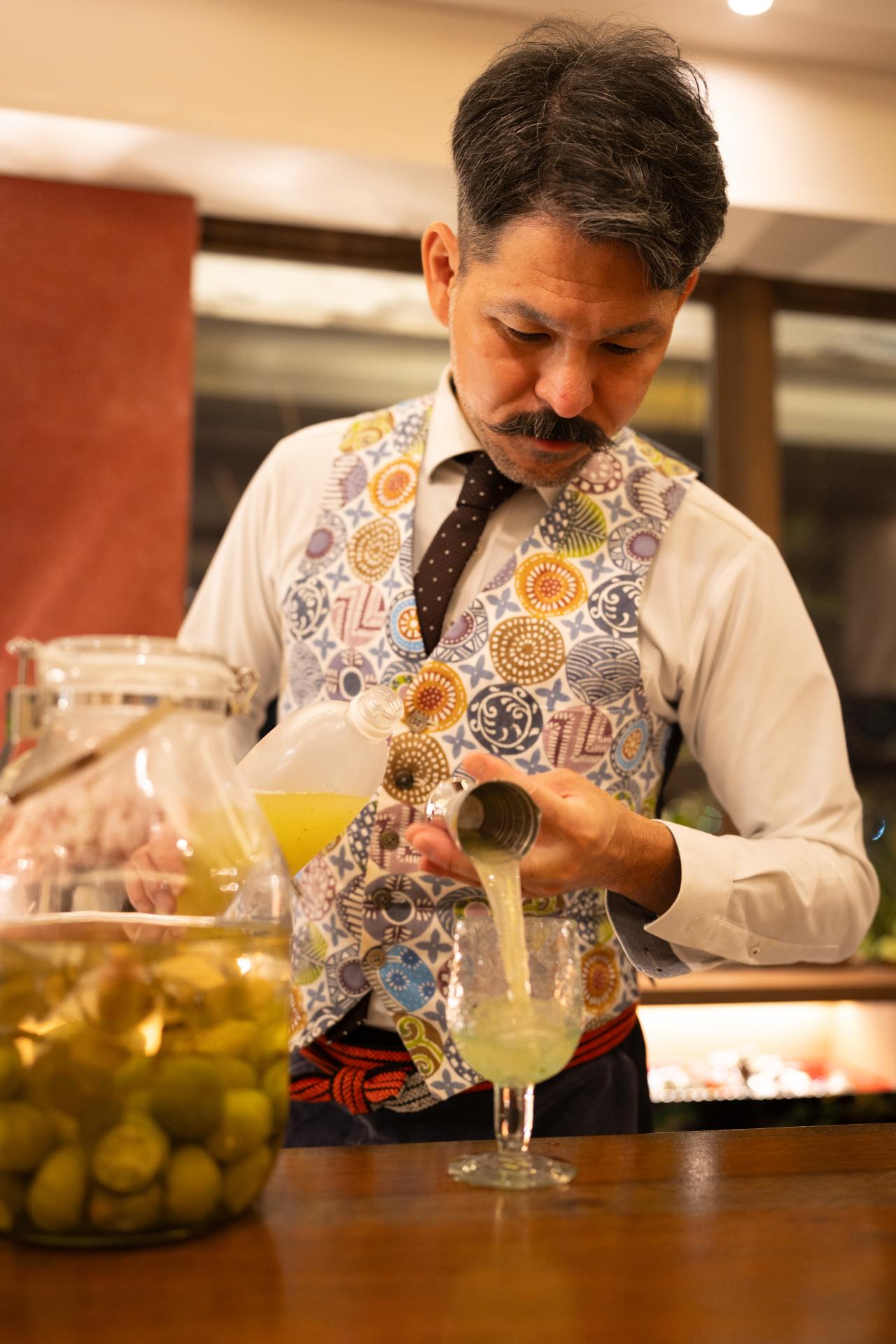 Bar owner Koji Higa prepares an awamori-based cocktail at his bar, Higatei. Bar owner Koji Higa prepares an awamori-based cocktail at his bar, Higatei.