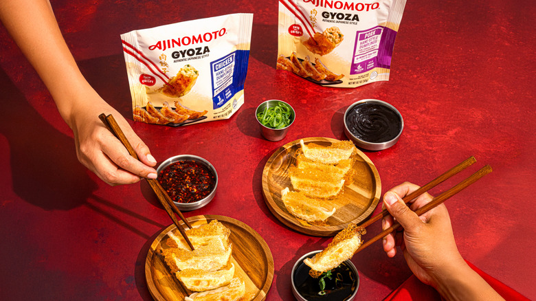 Shared gyoza and dipping sauces on table