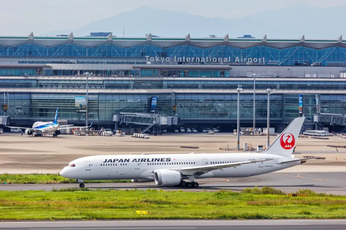 Japan Airlines Bans Crew Alcohol During Layovers Japan Airlines Boeing aircraft taxiing at Tokyo International Airport with terminal in the background