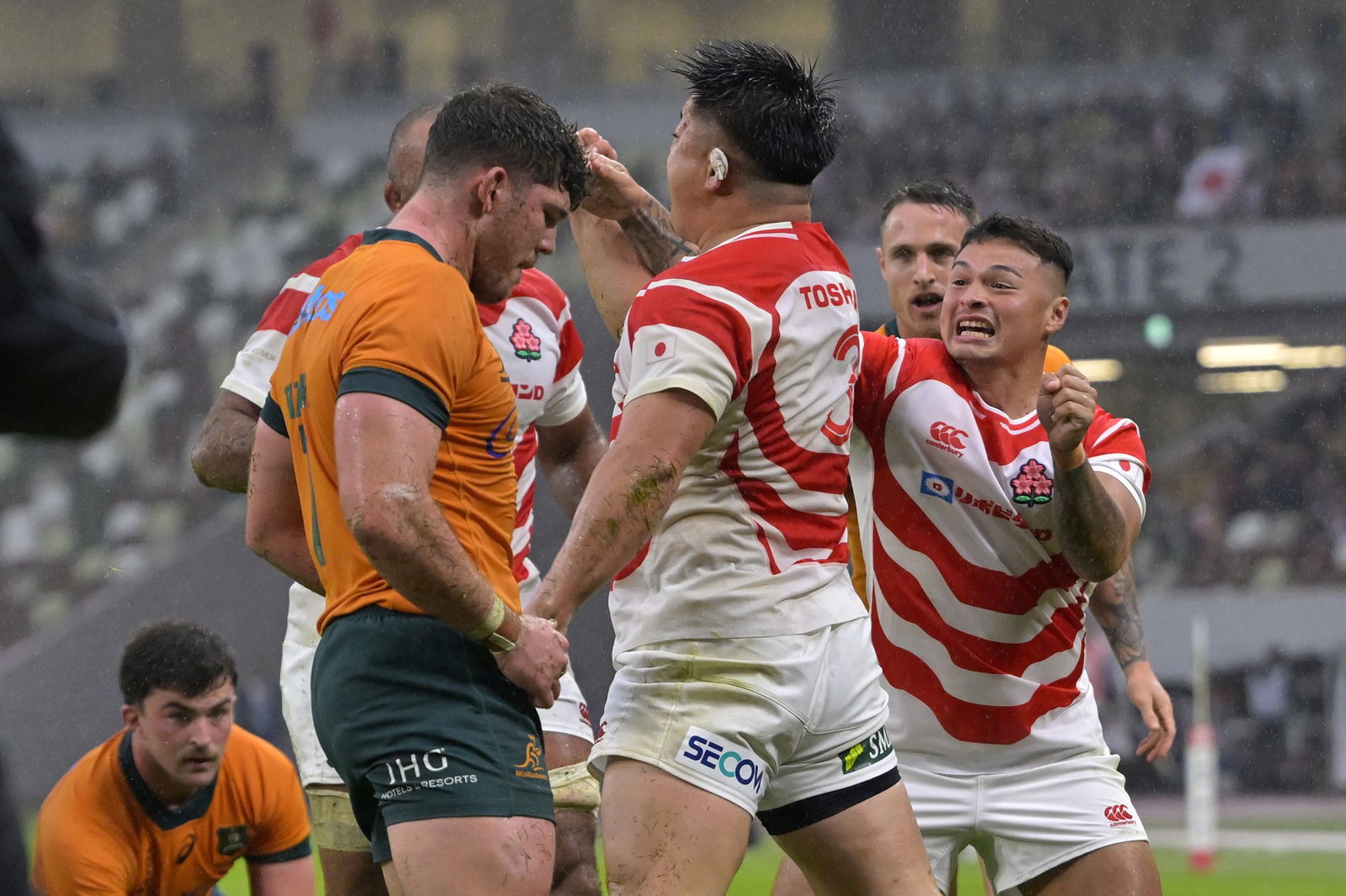 Shuhei Takeuchi celebrates a try for Japan.