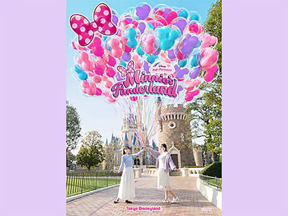 Two women in white dresses hold Minnie balloons at Tokyo Disney Resort, with its unique Cinderella Castle distinct from Walt Disney World’s.