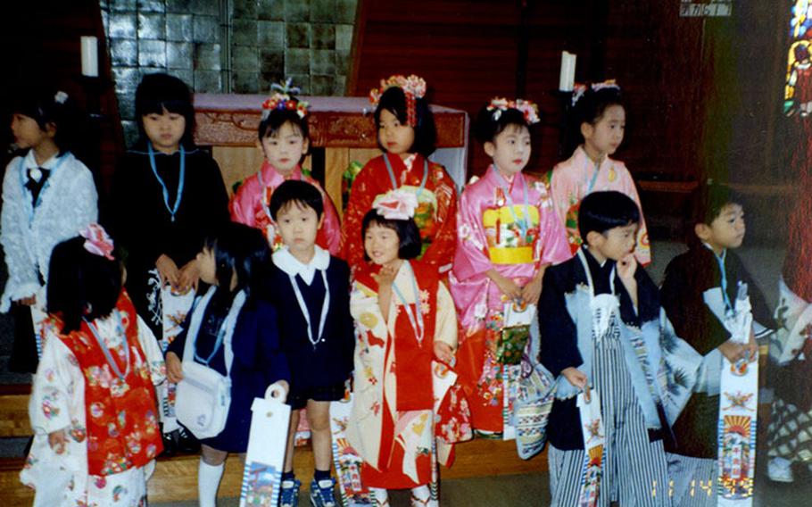 Children pose for a photo.