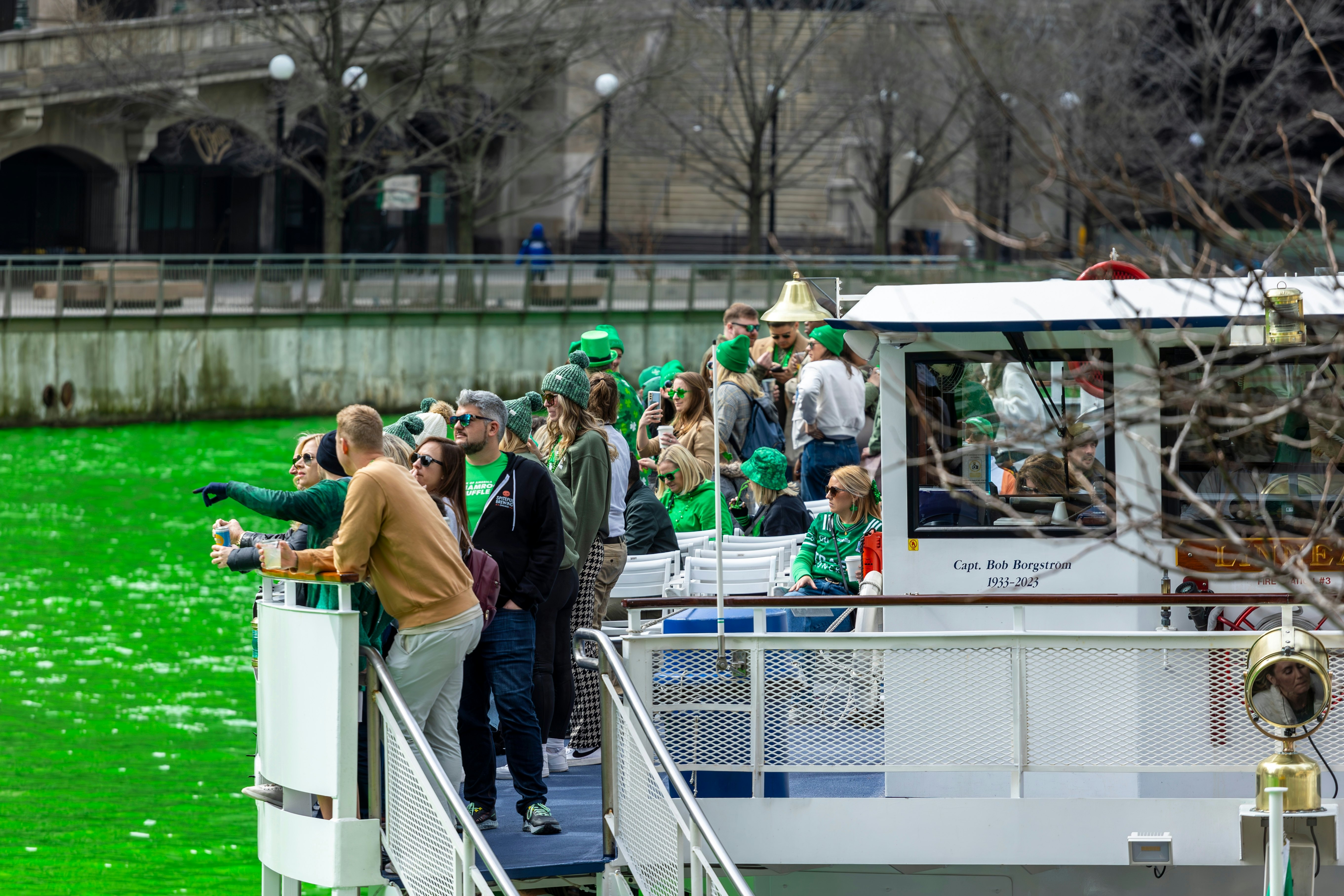 St Patricks celebration on Chicago River, which has been dyed green for the occasion