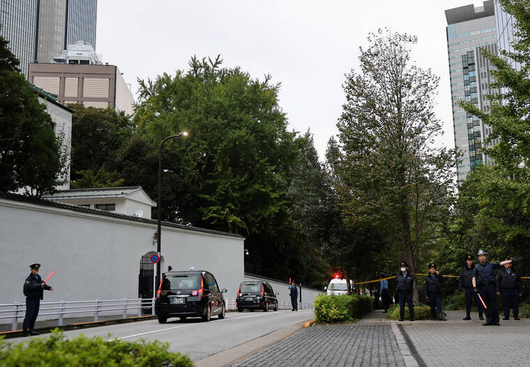 REUTERS/KIM KYUNG-HOON
                                Policemen stand guard in front of a police line, near the U.S. embassy in Tokyo, Japan.