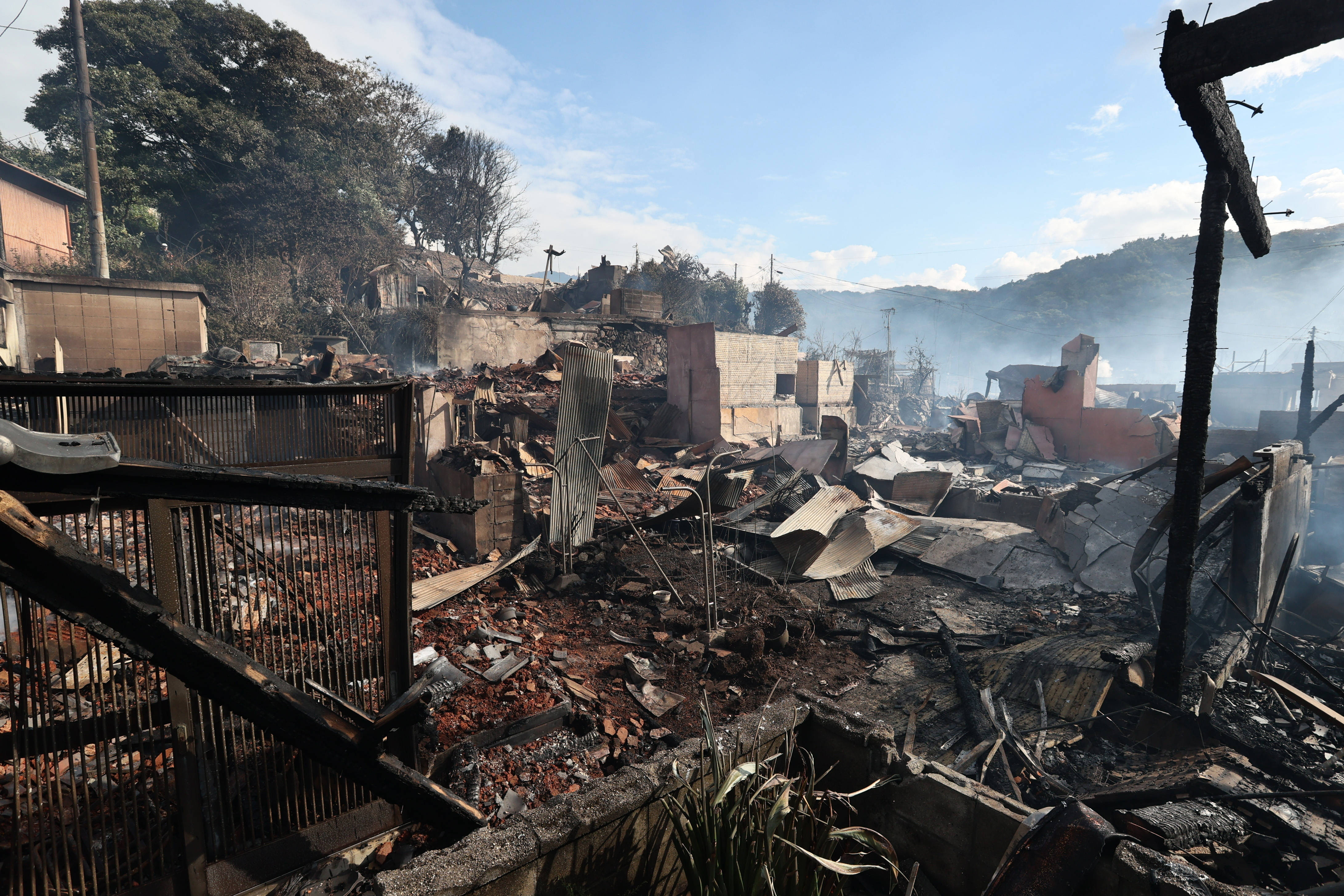 The burned remains of buildings in the Saganoseki district of Oita, Japan.