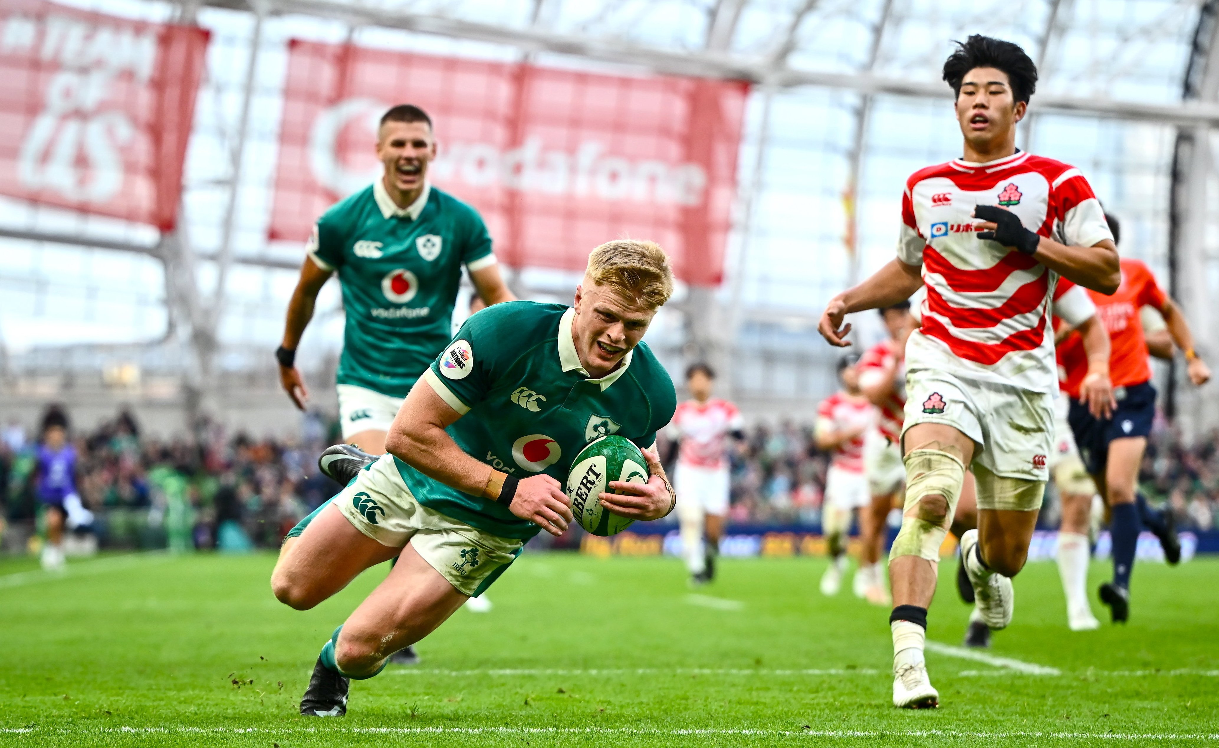 Tommy O'Brien of Ireland dives to score his sixth try against Japan.