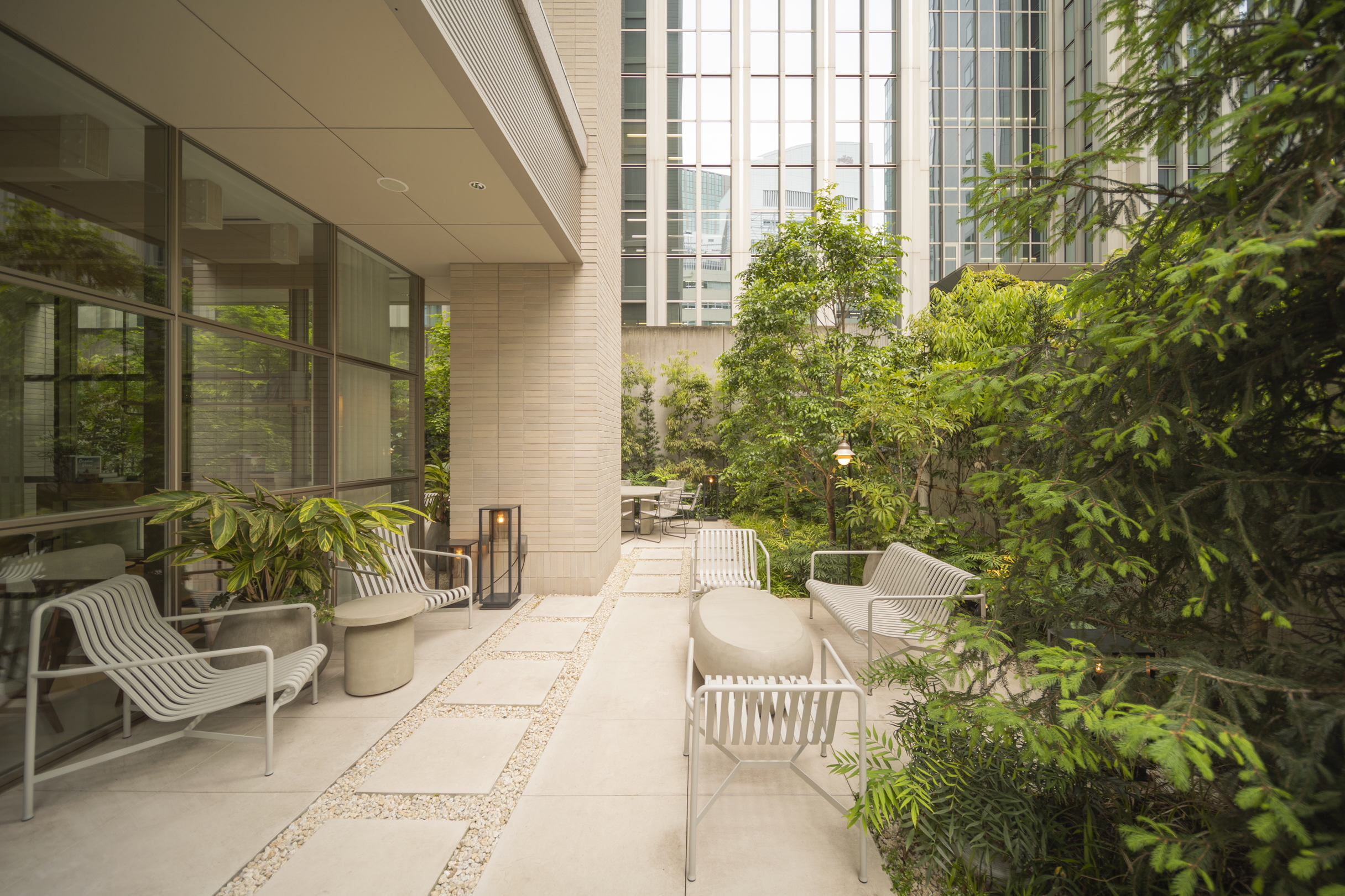 A greenery-filled guest terrace at Zentis Osaka hotel