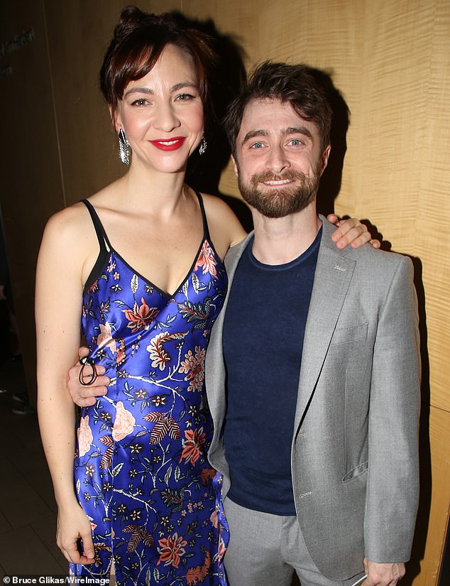 For the occasion, Danie, 36, cut a dapper figure in a grey suit while Erin, 41, stunned in a navy blue dress