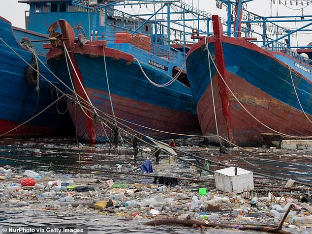 A view of piles of garbage polluting Muara Baru port in Jakarta, Indonesia, on May 22, 2023