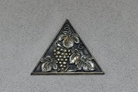 A grape-patterned relief above an arched door is seen in the old library on Kansai University's Senriyama Campus in Suita, Osaka Prefecture, Aug. 29, 2025. (Mainichi/Tsutomu Koseki)