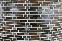 Dark brown salt-fired tiles on a wall of the round library, designed by Togo Murano, are seen on Kansai University's Senriyama Campus in Suita, Osaka Prefecture, Sept. 1, 2025. (Mainichi/Tsutomu Koseki)