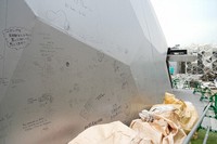 Messages left by visitors remain on the exterior wall of the Electric Power Pavilion, as seen in Osaka's Konohana Ward on Nov. 13, 2025. (Mainichi/Takashi Murata)         