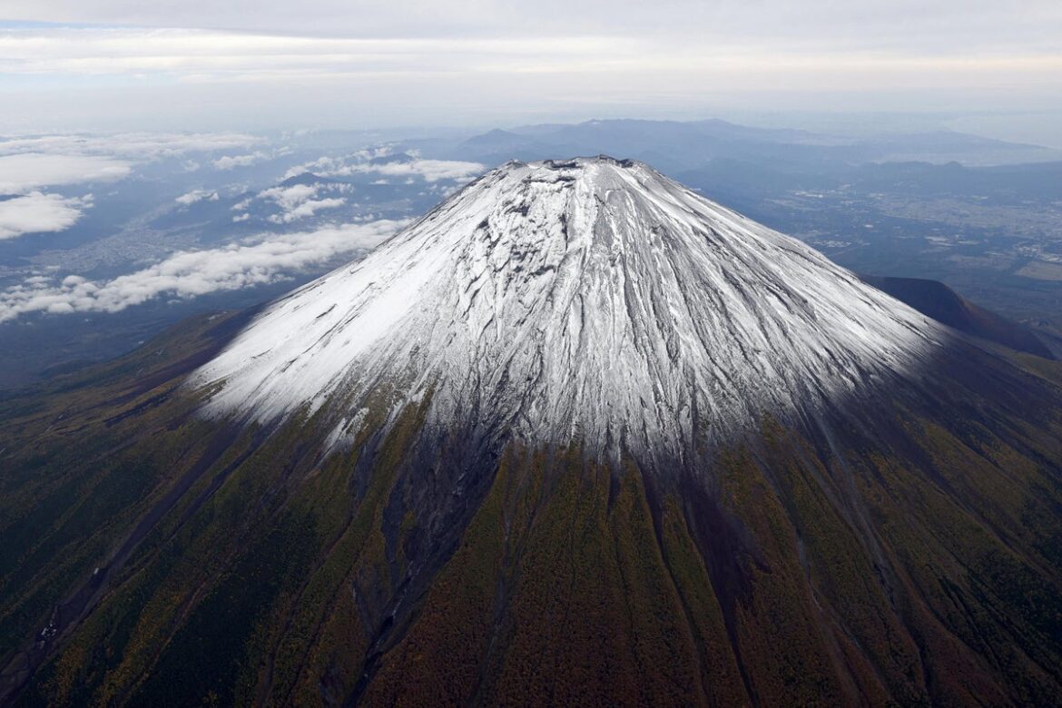 Iconic Mount Fuji finally gets season’s first snowcap – three weeks later than usual