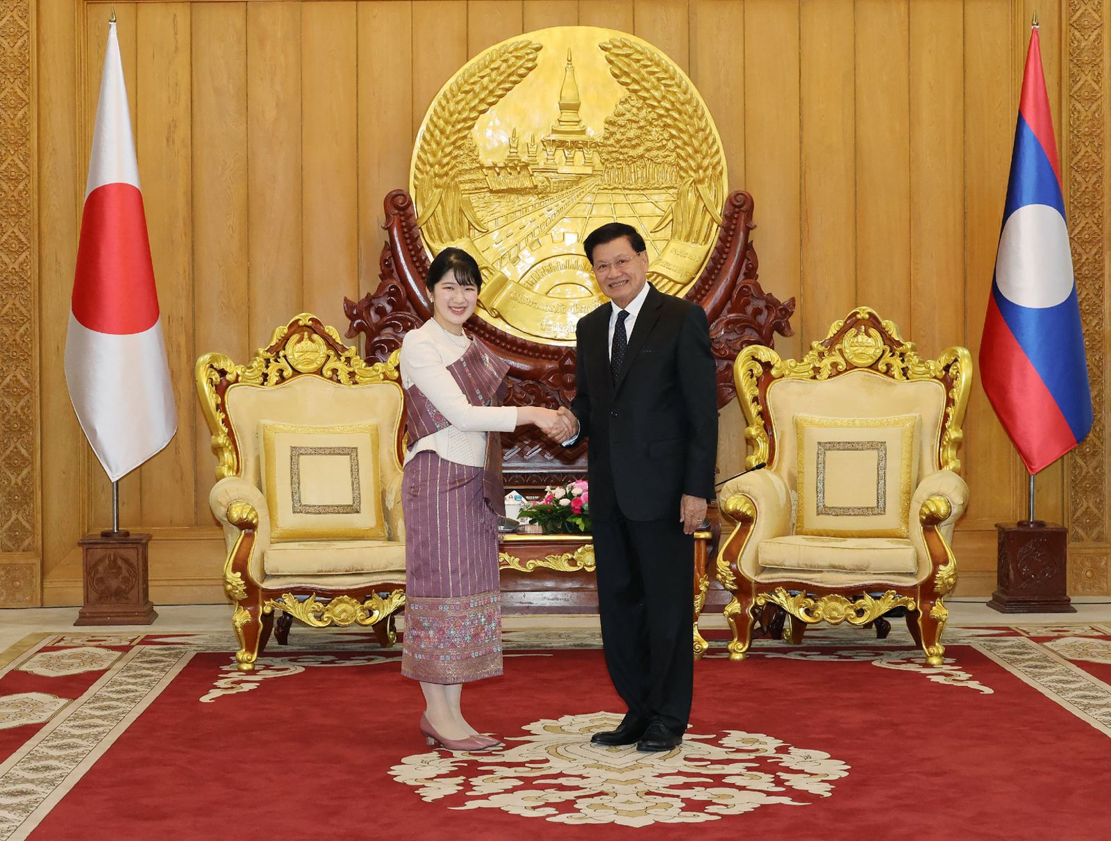 Image may contain Thongloun Sisoulith Clothing Formal Wear Suit Adult Person and Wedding