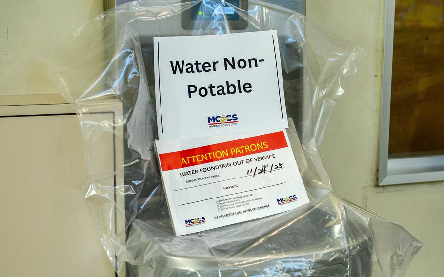 A sign taped to a chair says “water non-potable.”
