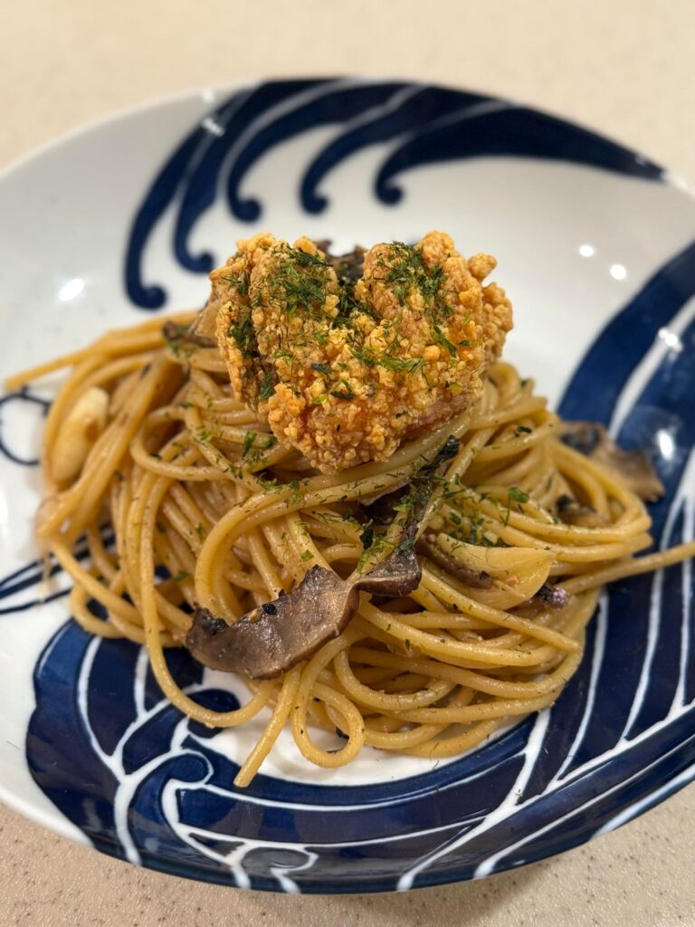 Wafu mushroom miso pasta topped with karage & aonori