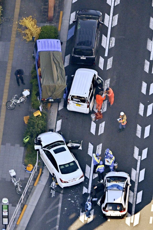 Aerial view of car accident with white car 