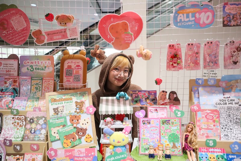 Artist selling stuff at a booth